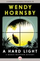 A Hard Light (A Maggie MacGowen Mystery #5) - Wendy Hornsby