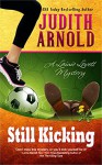 Still Kicking: A Lainie Lovett Mystery (The Lainie Lovett Mysteries Book 1) - Judith Arnold