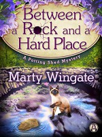 Between a Rock and a Hard Place: A Potting Shed Mystery (Potting Shed Mystery series Book 3) - Marty Wingate